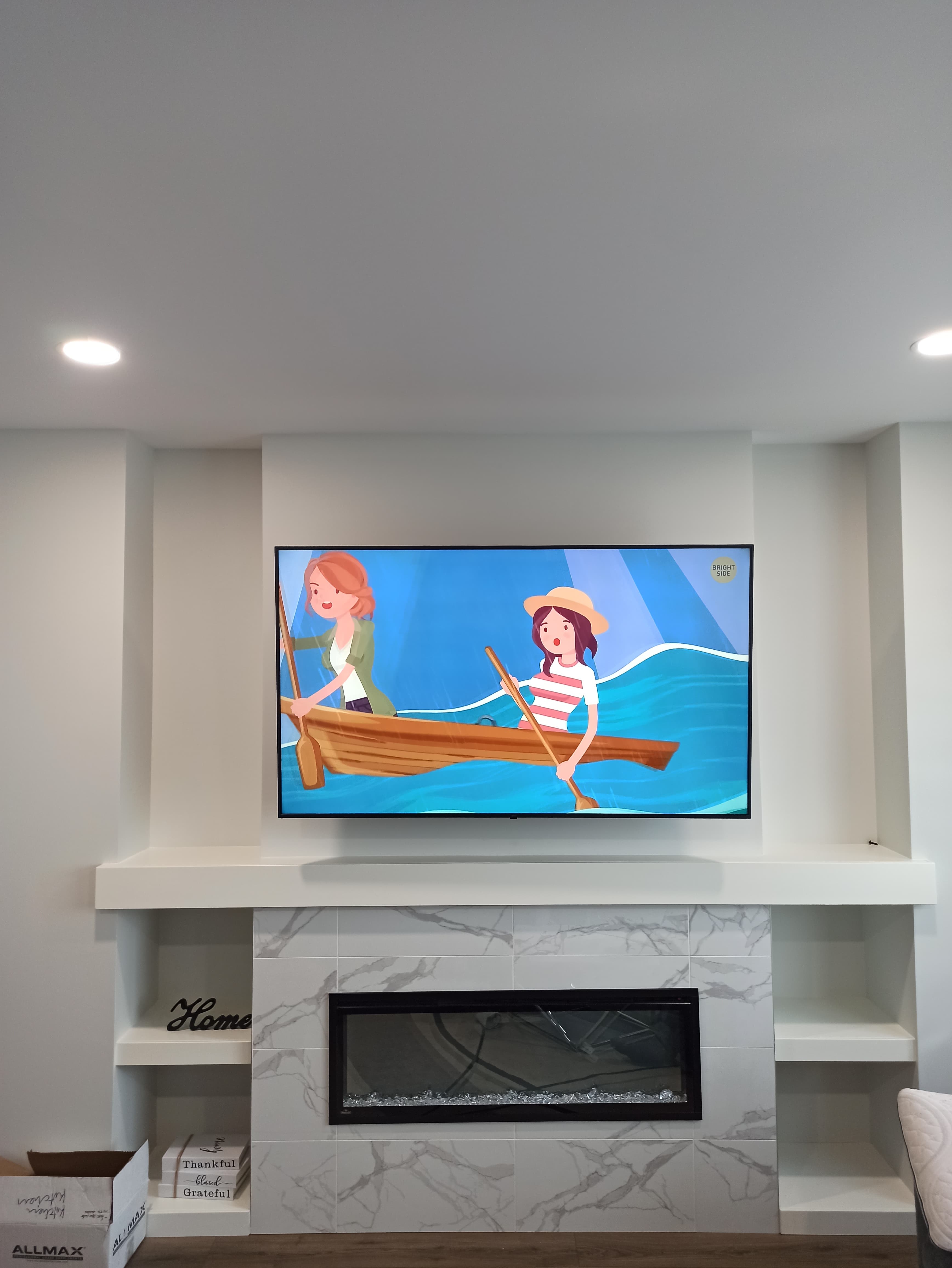 TV mounted in modern entertainment wall unit Winnipeg